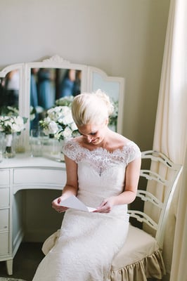 Bride prepping for her wedding in Dove Cottage