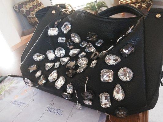 Can you re stitch rhinestones back on leather bag?