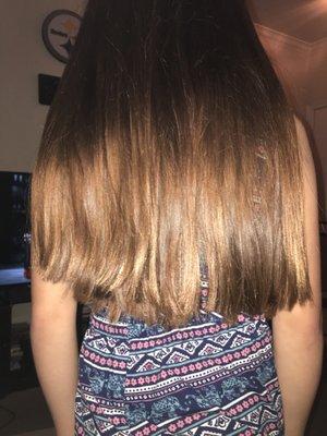 My daughter also got a trim and it looks really crooked