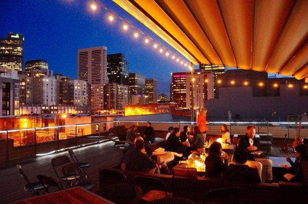 Guests on the roof deck will enjoy a panoramic view of the city while they lounge and mingle in the lavish open-air space.