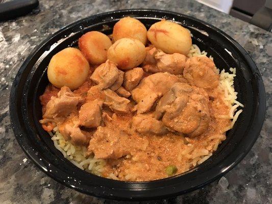 Chicken tikka bowl with jasmine rice and potatoes.