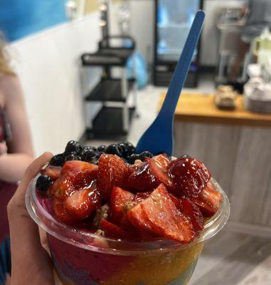 Mango Berry Bowl: Mango base topped with strawberries, blueberries, granola, and honey