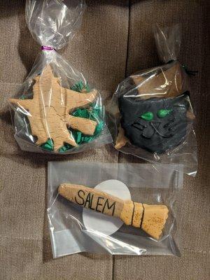 Top: Each bag of two cookies with witch design and black cat, $6.99 prior to tax. Bottom: Salem broom cookie, $3.99 prior to tax