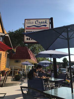 Outdoor seating along Benzie blvd. Umbrellas to give you some protection from the evening sun.