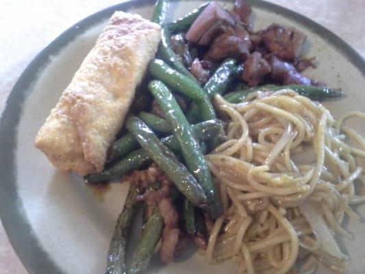 Tasty green beans and pork with teriyaki chicken, noodles, and an egg roll.