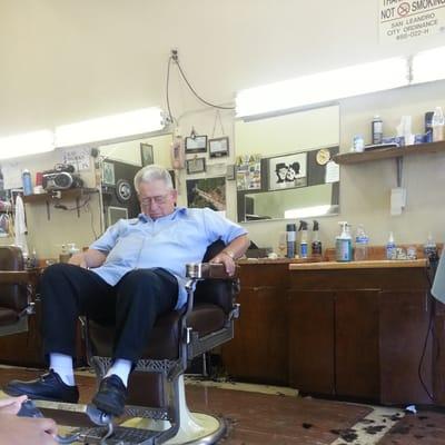 One of the barber's at Sam's catching some Zzz's