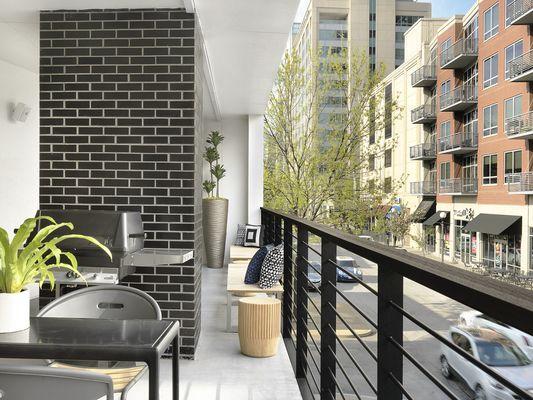 Outdoor grilling on balcony overlooking St. Louis' Central West End