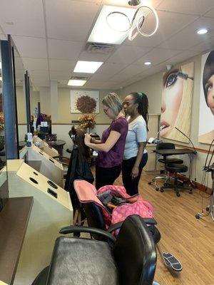 One of our Awesome Instructors giving some hands on assistance with a Cosmetology Student