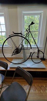 Bike that the mansion owner invented. It didn't have a chain.