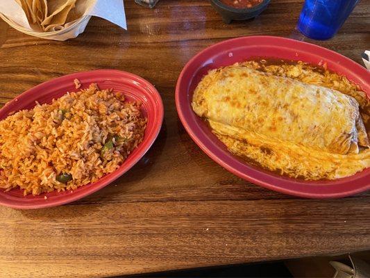 Bean and cheese Burrito, enchilada style with a side of rice