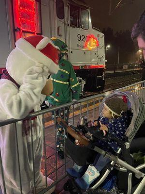 Holiday Caltrain. You can't get on it. Santa and helpers visit selected stations 1st full wknd in Dec. Carolers, faux snow machine, too!