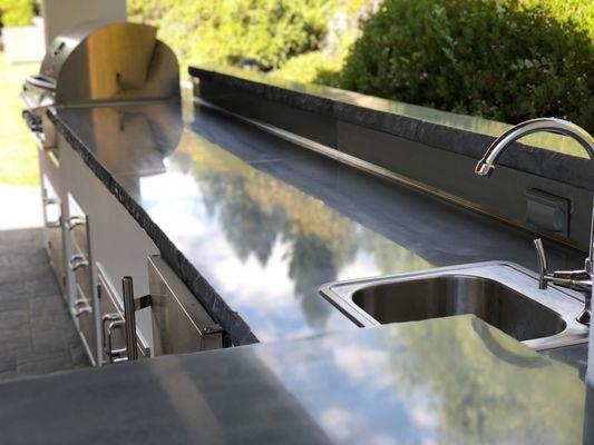 Exterior kitchen with polished concrete countertops