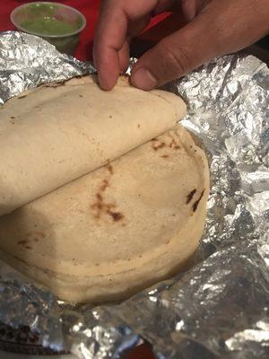 very thick and uncooked tortillas , they need a real tortillera lady