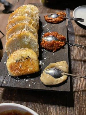 BREAD BOARD rosemary & fennel seed foccocia, olive oil, roasted garlic, calabrian chili and tomato "jam"