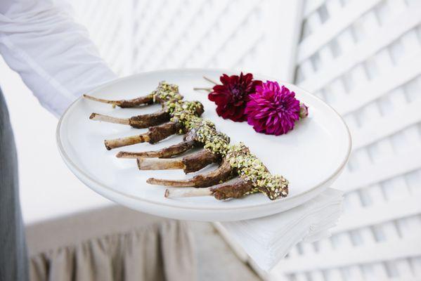 Pistachio crusted lamb pop hors d'oeuvre.