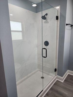 Glass Enclosure with Marble Walls and Marble Floor