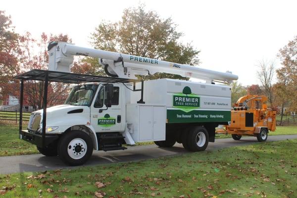 We have a 65' Bucket Truck.  We can safely trim or remove very tall trees