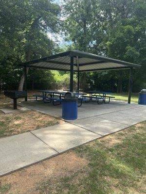 Picnic shelter, trash cans, and grill