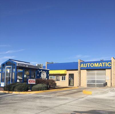 An automatic car wash bay, along with a dog wash.