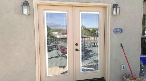 Entry door with blinds