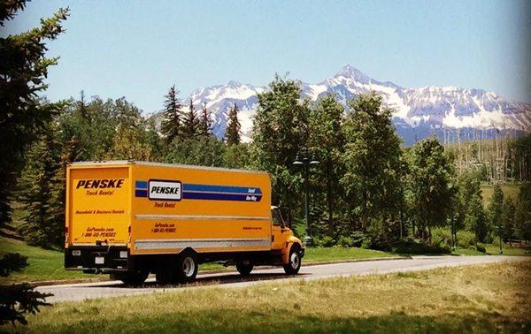 Reno Tahoe Movers truck passing by the mountains in Tahoe