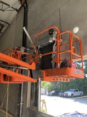 Setting anchors and core drilling pick holes for boom lift.