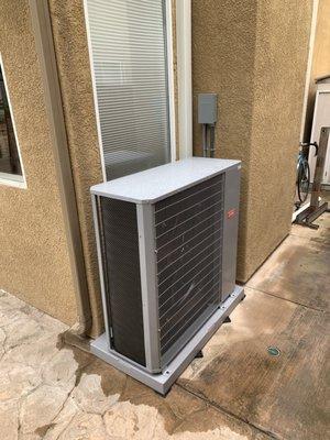 New SlimLine quiet and efficient condenser unit tucked away on the side of the house where nobody sees or hears it. Love it!