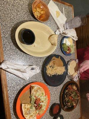 Sopapillas (one left), brisket quesadilla, chicken fajitas, rice, beans