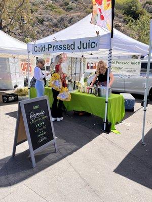 What Our Booth Looks Like At The Farmers Markets - Can't Miss The Bright Green : )