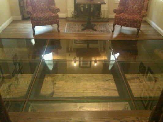 Glass floor showing historic remains of the Calvert house