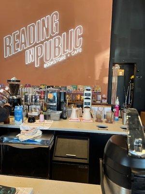 coffee bar with children's books behind it