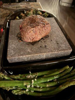 Filet mignon on hot rock. The best way to eat it. I also tossed the asparagus on the hot rock and sear those as well.