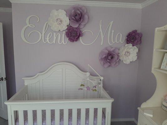 Painted room, assembled furniture, hung sign and flowers, installed crown molding