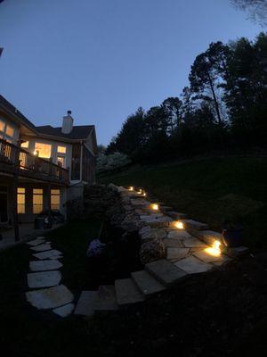 Suburbia replaced our walkway, down the hillside and from there to the lower patio.  The lighting makes the back yard so inviting!