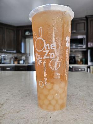 Grapefruit green tea with honey boba.