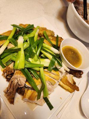 Steamed chicken on a bed of rock salt.