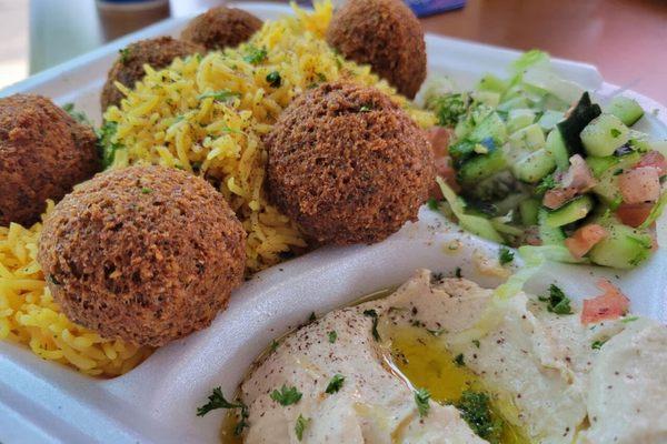 Very delicious falafel all the rice with hummus, and taziki