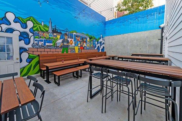 Outdoor Patio with mural by Aaron Kai