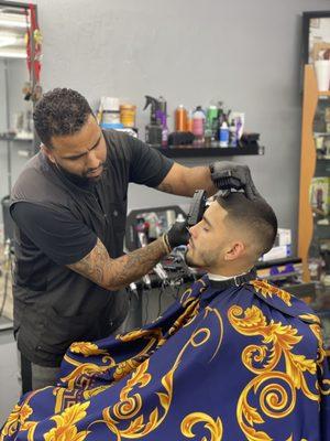 Lu barber , very experienced,  always very detailed fades & lines in his cuts