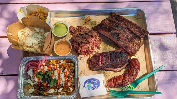 Pork Spare Ribs, Brisket, Pulled Lamb Shoulder, Sausage Link, Smoked Kimchi, Dan Dan Frito Pie, Queso y Pepe, and Sahil's Aloo