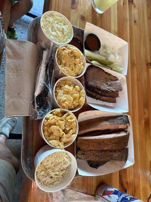 Brisket, ribs, mac & cheese, potato salad, coleslaw, with pickles, and onions. 66 before tip.