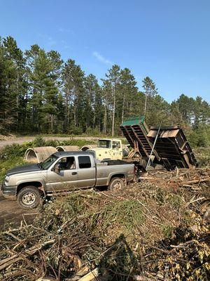 The old dump truck I grew up using with my father next to my new dump setup.