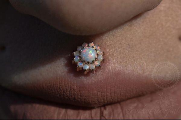 Rose gold opal philtrum piercing