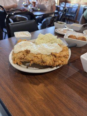 Chicken fried steak, pan seared pork, hush puppies with tangy orange butter, turnip greens and white beans AND peach cobbler cake!!!