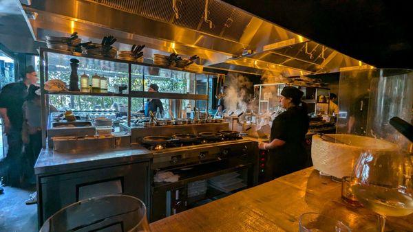 View from the barstools directly into the kitchen