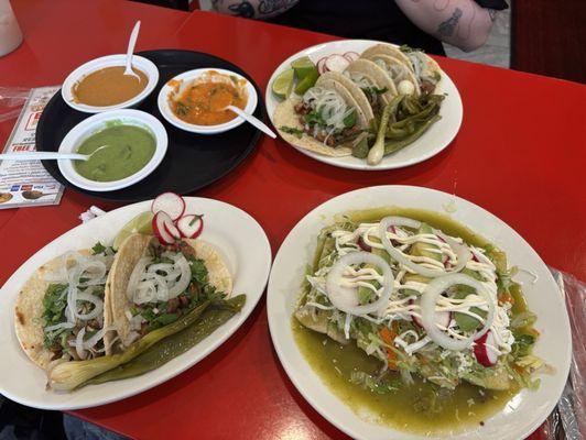 taco de tripa res  (1 order has 4 tacos)  taco de oreja (left side on lower left corner)   enchilada with salsa verde and beef