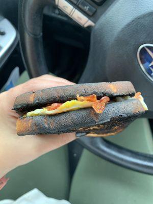 Very burnt bacon egg and cheese