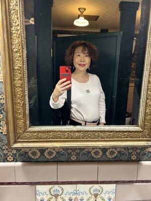 Old fashion restroom with ornate mirrors