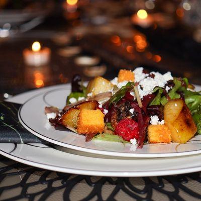 Our mix greens salad with homemade corn bread croutons and goat cheese.