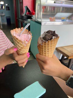 Half eaten small and large waffle cone